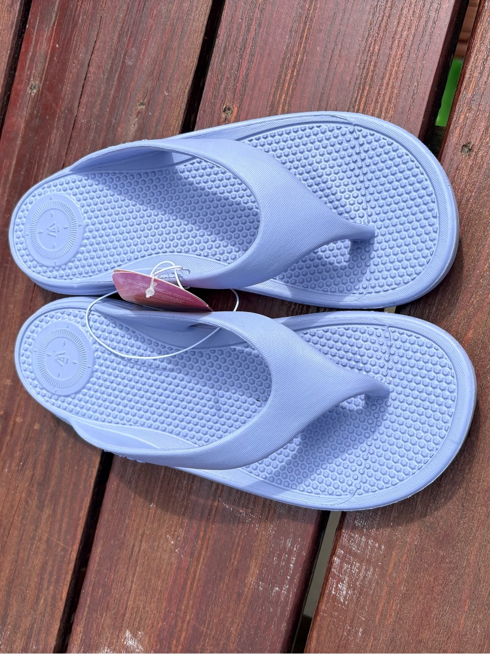 Totes Solbounce flip flops in lavender